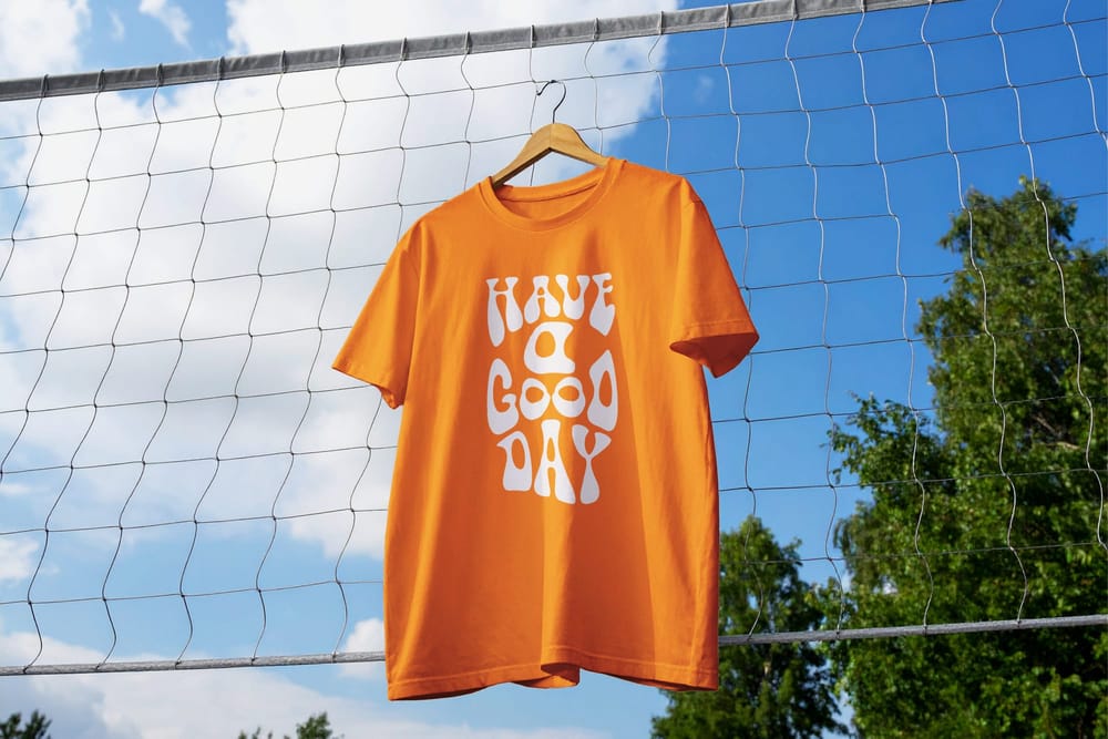 Outdoor Hanging White T-Shirt Mockup on Net Background