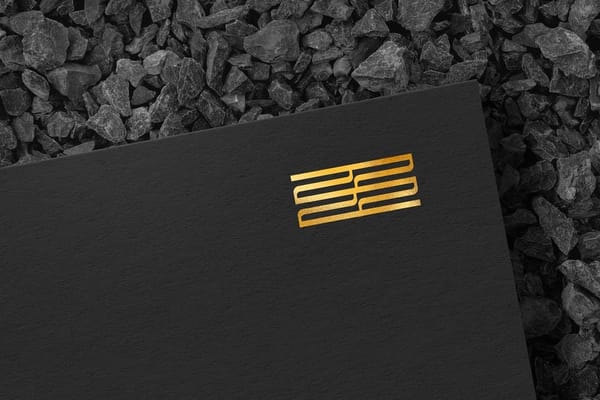 Elegant Gold Foil Logo Mockup on Black Paper