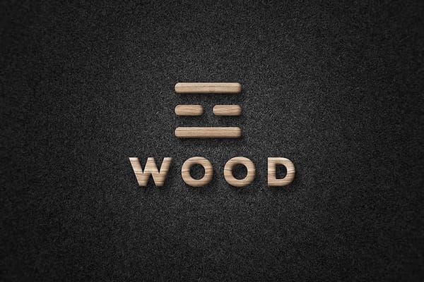 Embossed Wood Logo Mockup on Black Paper Texture